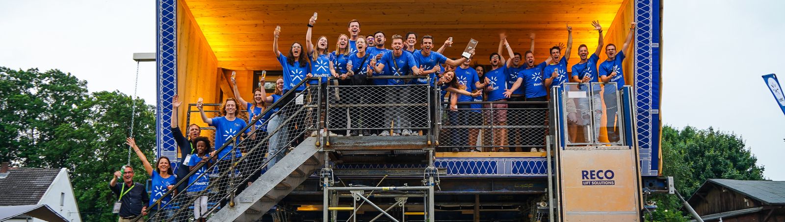 The RoofKIT winning team celebrates their achievement at Solar Decathlon Europe 21/22 next to their demonstration house on the premises of the Solar Campus in Wuppertal.