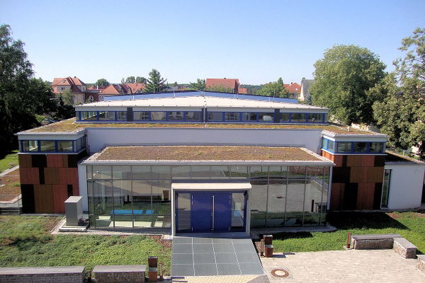 Bird's eye view of the north view of the sports hall with a view of the green roof